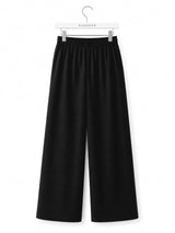 Back view of Nasseeb Women's Essence Trousers in black