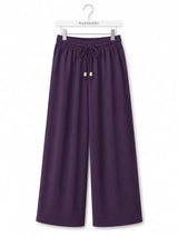 Back view of Nasseeb Women's Essence Trousers in purple